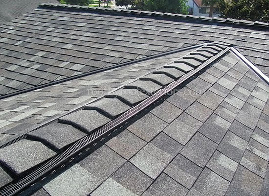 Ridge vent running along a freshly shingled roof