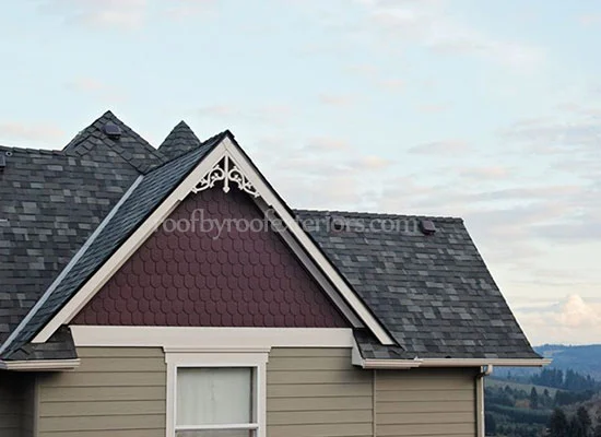 Gable end with decorative trim, siding and fresh shingles